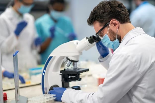 scientist with microscope